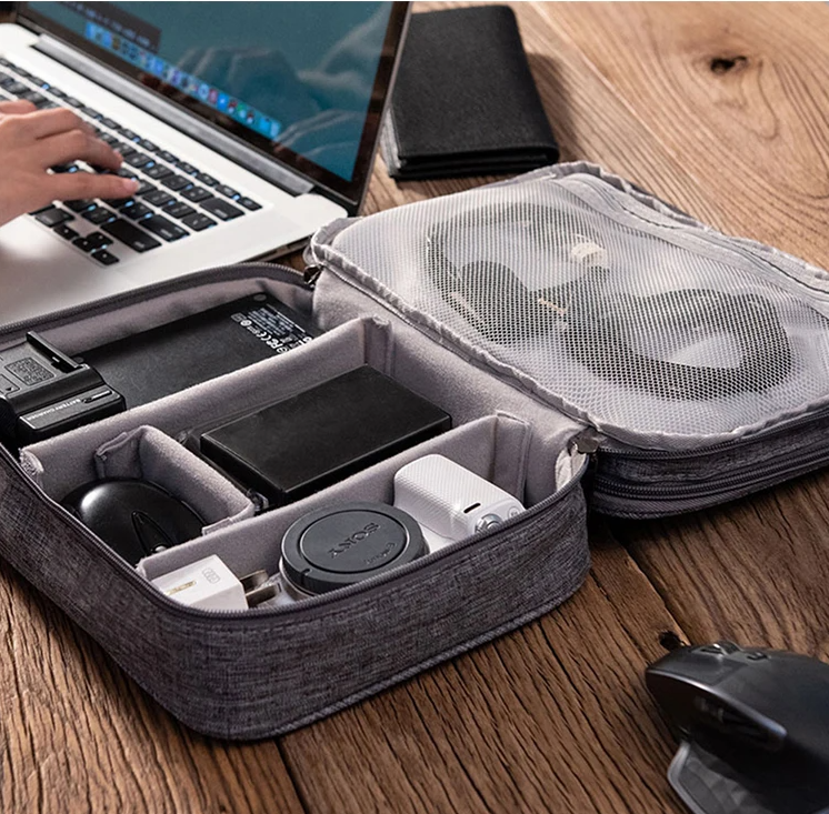 Organized cable management inside the Pro-Travel pouch with red and grey USB cables secured by elastic loops