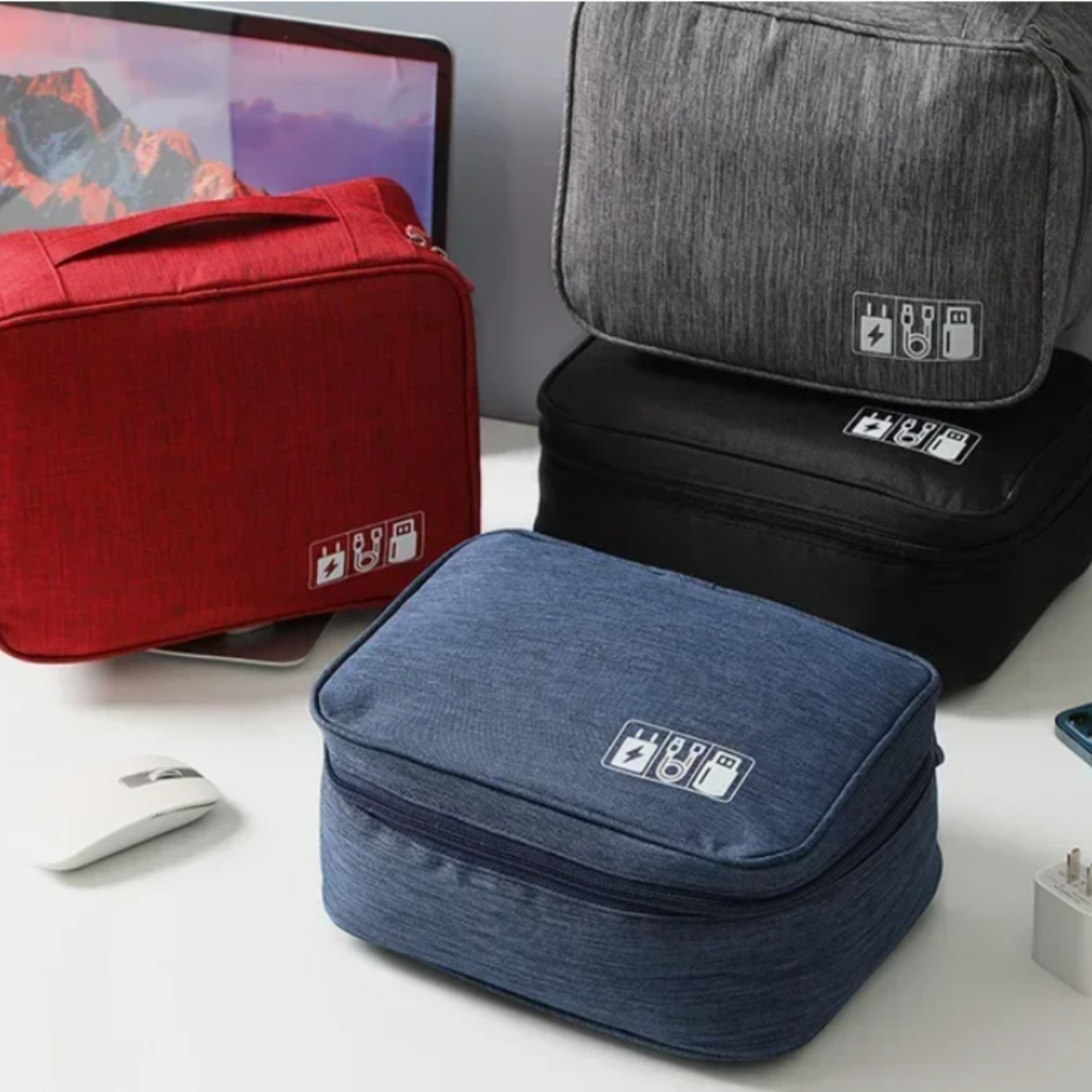 Open Pro-Travel Tech Organizer in red showing internal compartments filled with cables, power banks, and mouse
