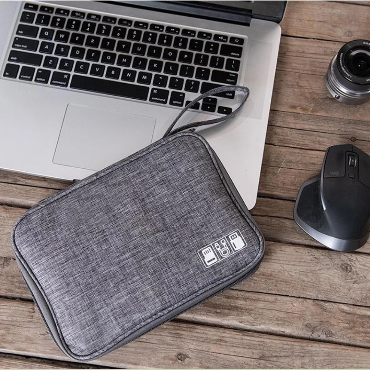 Grey tech organizer bag on a wooden desk next to a laptop and mouse for mobile creators - YourStation - Buy with crypto: Bitcoin, Ethereum and more