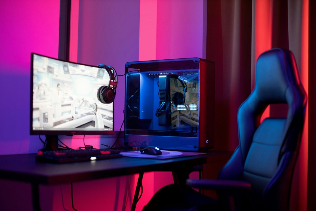 Professional gaming setup with RGB custom PC, streaming chair, and dual monitor station for creators - YourStation