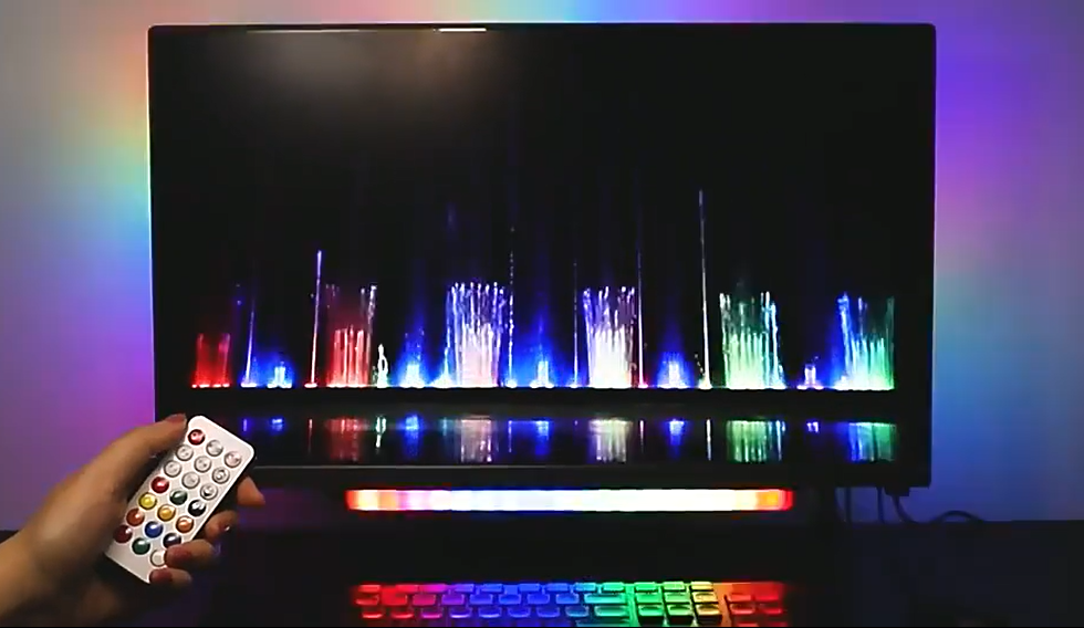 Aura Bars Pro RGB LED ambient light bars showing dynamic colors with a remote control and smartphone app interface.